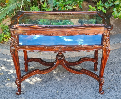 CARVED MAHOGANY DISPLAY TABLE. SIZE: 89CM X 50 X 71H. PRICE: R9750.00